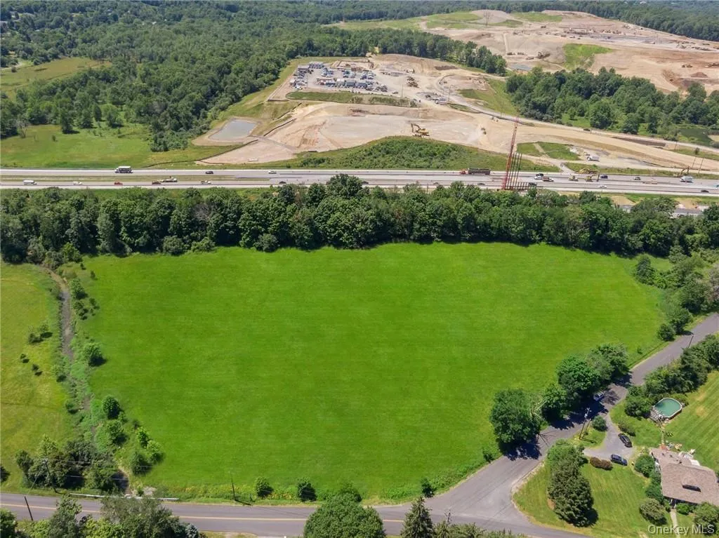 Looking approximately south, Otterkill is on left, Duck Farm Road on right, and Old Chester Road in foreground and Heritage Trail at the rear of the property. The raised trail bed and tree cover provide wonderful sound protection from the highway. Route 17M is obscured by the trees. Route 17/Quickway/Future I-86 is seen beyond trees with LEGOLAND New York (coming 2020) construction proceeding in the distance. Looking approximately south, Otterkill is on left, Duck Farm Road on right, and Old Chester Road in foreground and Heritage Trail at the rear of the property. The raised trail bed and tree cover provide wonderful sound protection from the highway. Route 17M is obscured by the trees. Route 17/Quickway/Future I-86 is seen beyond trees with LEGOLAND New York (coming 2020) construction proceeding in the distance.