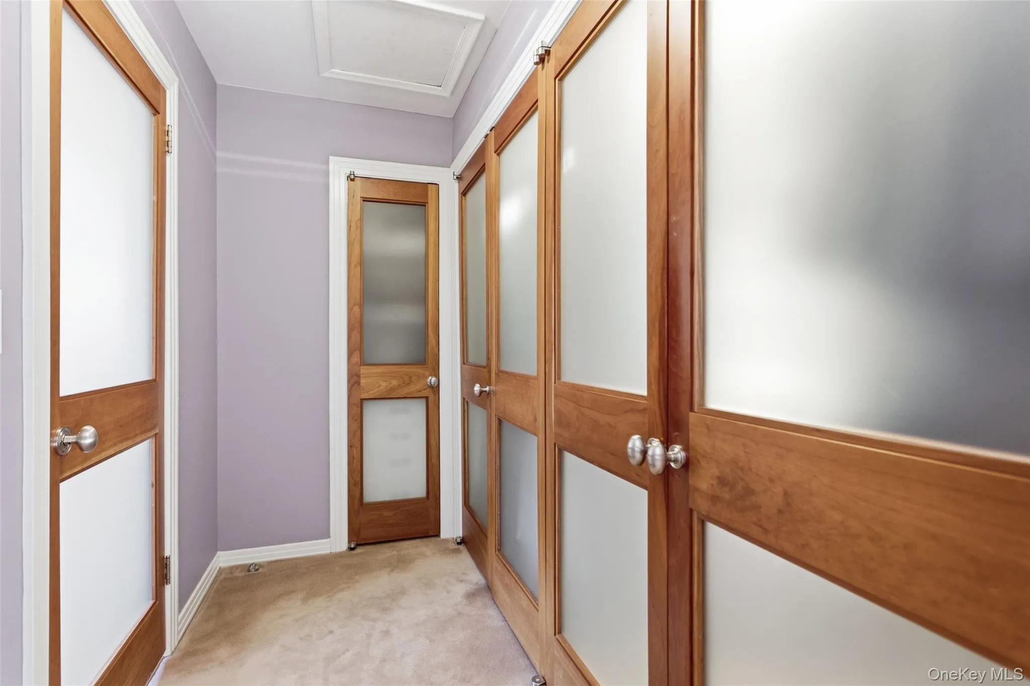 Fully attached walk-in closet, with custom built-ins, off the primary bedroom Fully attached walk-in closet, with custom built-ins, off the primary bedroom