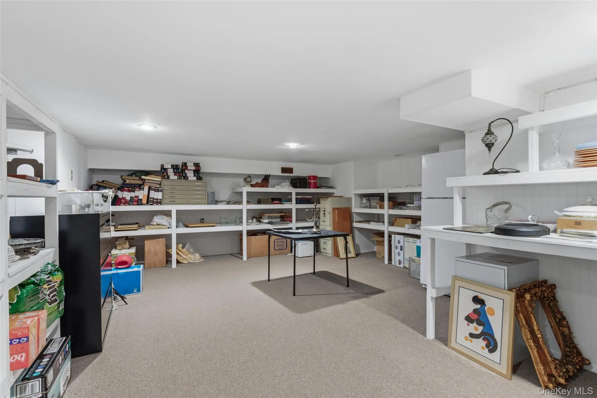 Finished basement that spans the whole house, currently being used as storage and an office space Finished basement that spans the whole house, currently being used as storage and an office space