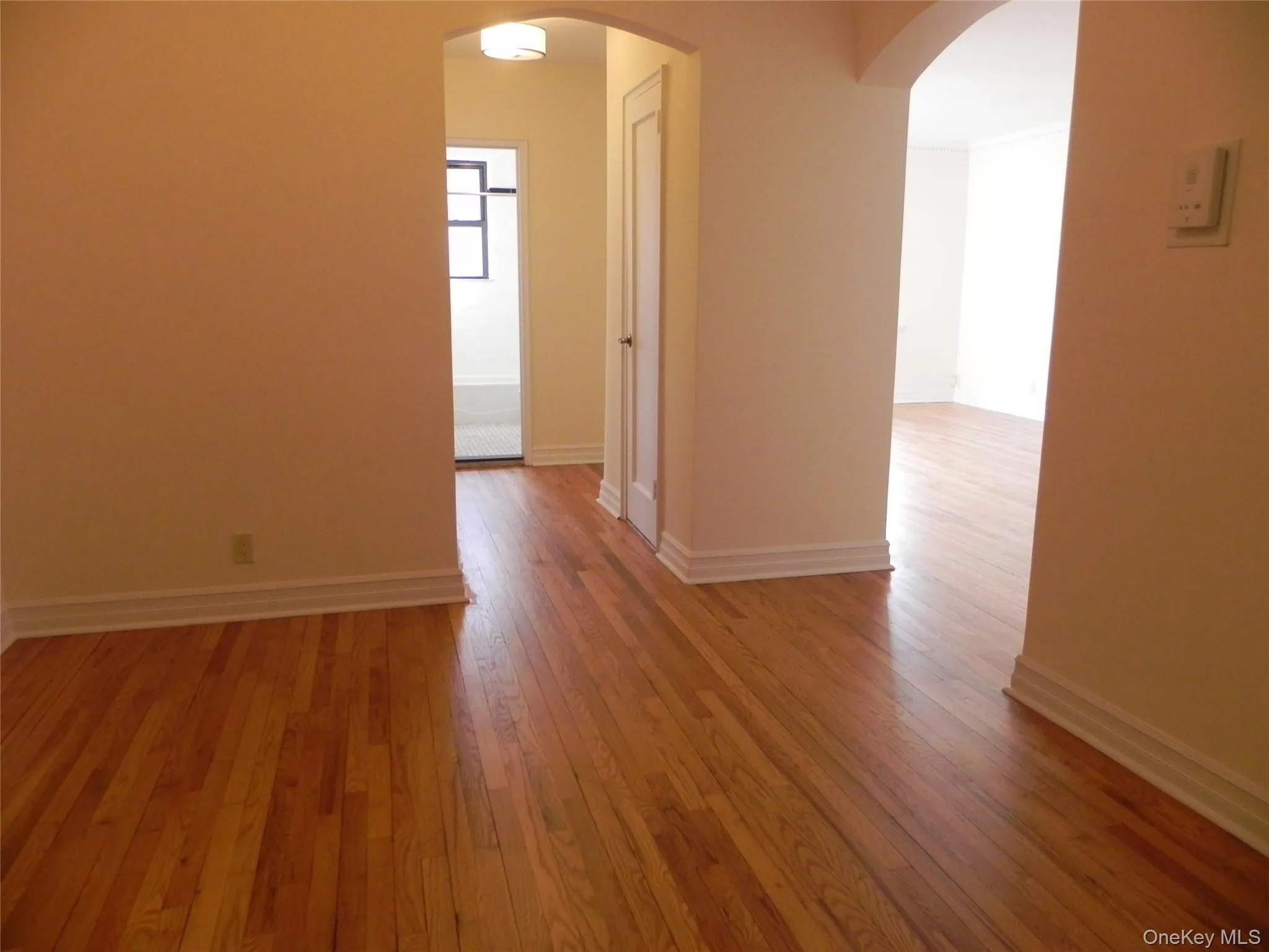 Entry with hardwood floors throughout Entry with hardwood floors throughout