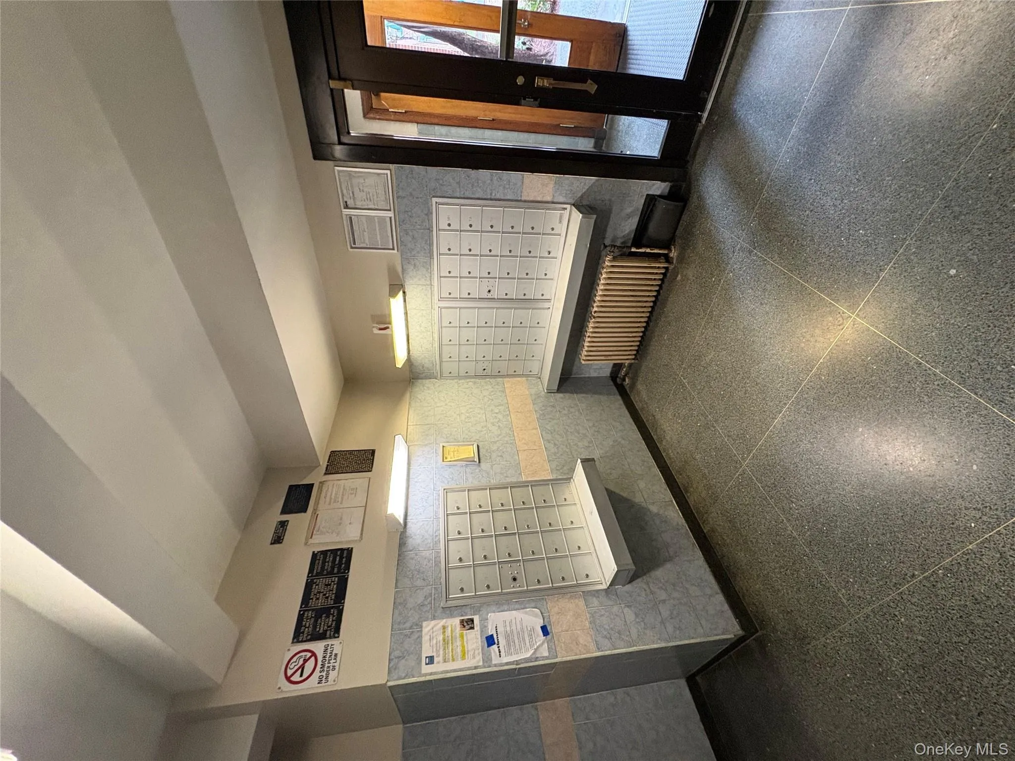 View of property's community featuring mail area and wallpapered walls View of property's community featuring mail area and wallpapered walls