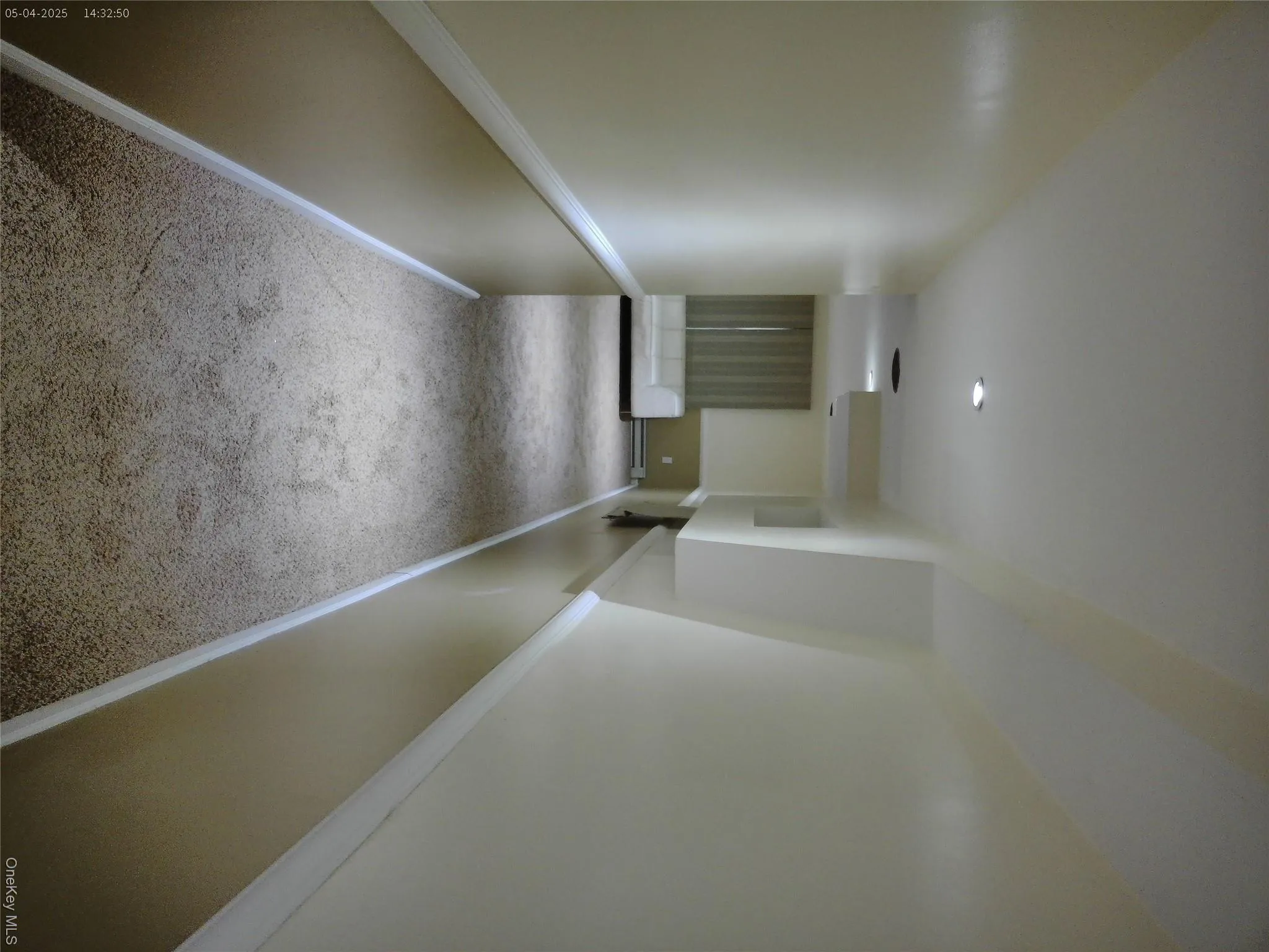 Hall with carpet floors, baseboards, and a baseboard heating unit Hall with carpet floors, baseboards, and a baseboard heating unit