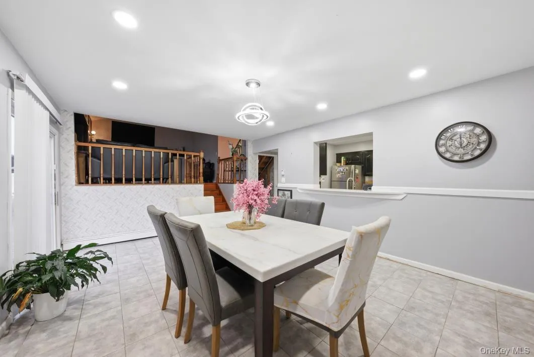 Dining room with stairway and recessed lighting Dining room with stairway and recessed lighting
