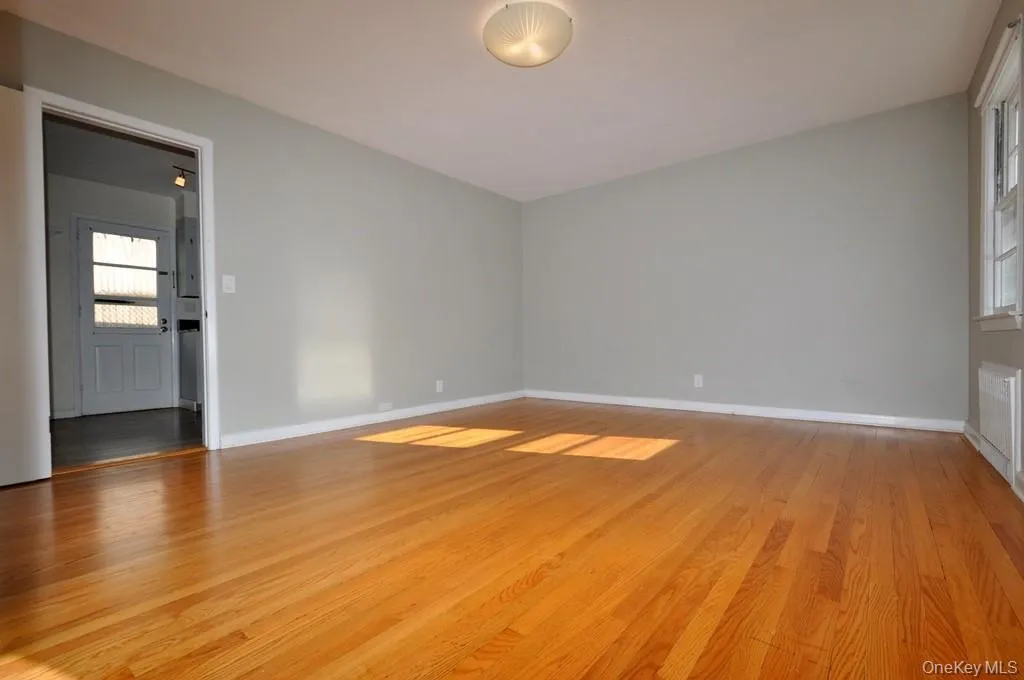 Large Living Room with Southern Exposure and refinished hardwood floors. Large Living Room with Southern Exposure and refinished hardwood floors.