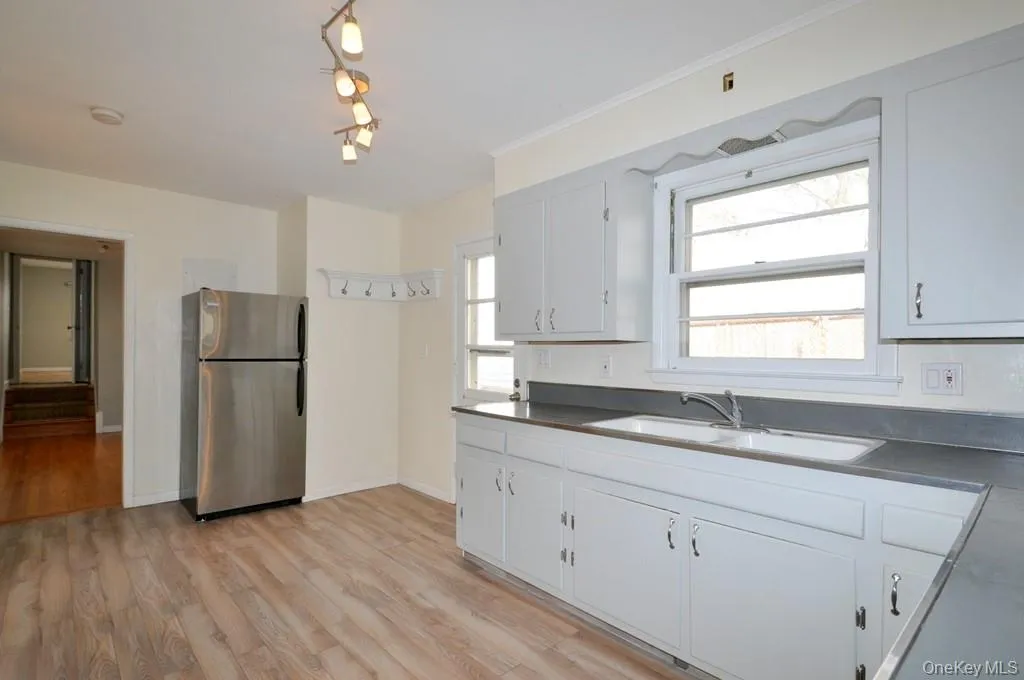Large Eat-in Kitchen with a stainless steel range and refrigerator. Large Eat-in Kitchen with a stainless steel range and refrigerator.