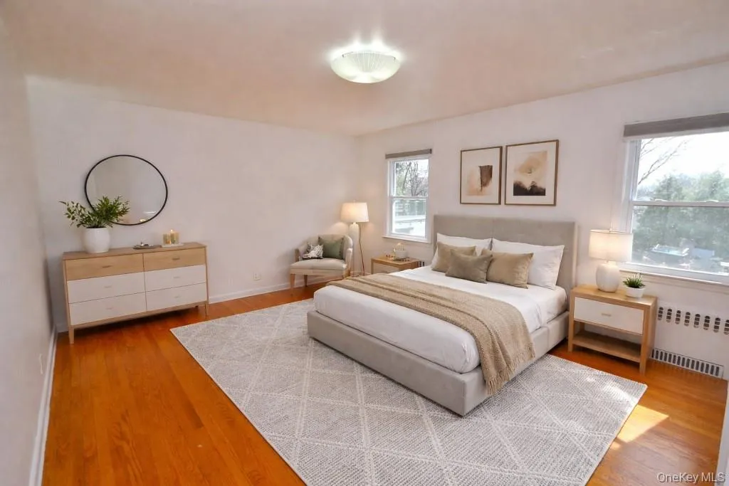 Photo Virtually Staged - Primary bedroom. Photo Virtually Staged - Primary bedroom.