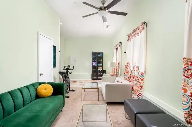 Great ROom on first floor with soaring ceilings, window wrapped walls and entry to lower level Great ROom on first floor with soaring ceilings, window wrapped walls and entry to lower level