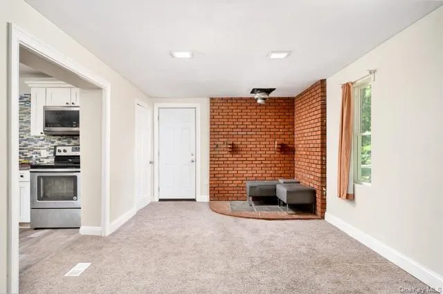 First floor Living Room , window wrapped walls First floor Living Room , window wrapped walls