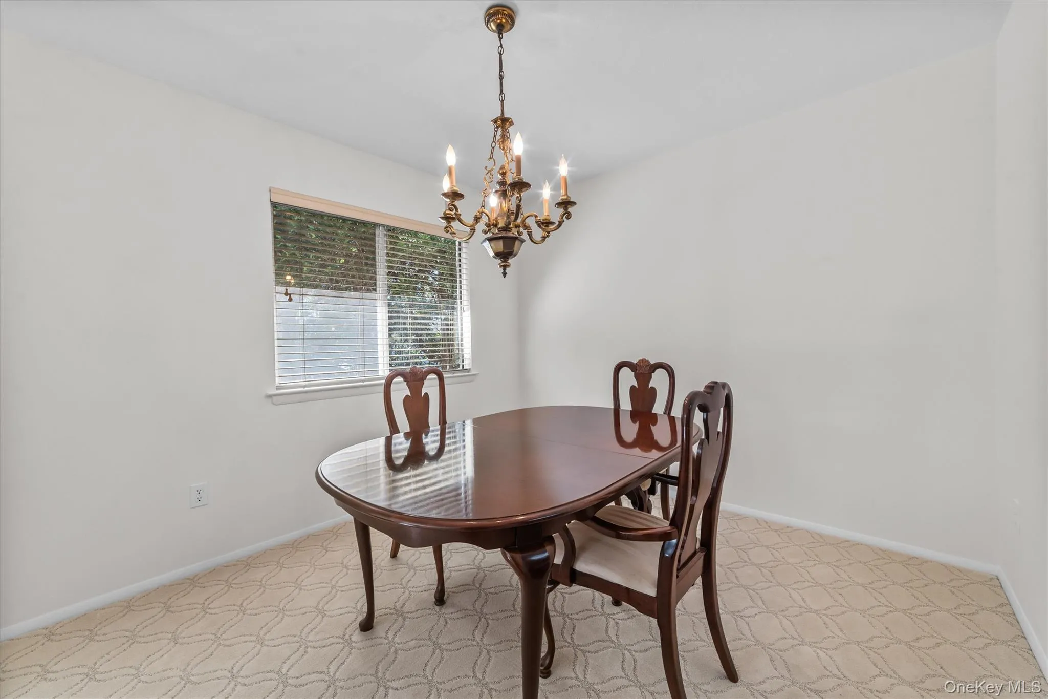 Dining room with chandelier and space can fit a table for 8 or more. Dining room with chandelier and space can fit a table for 8 or more.