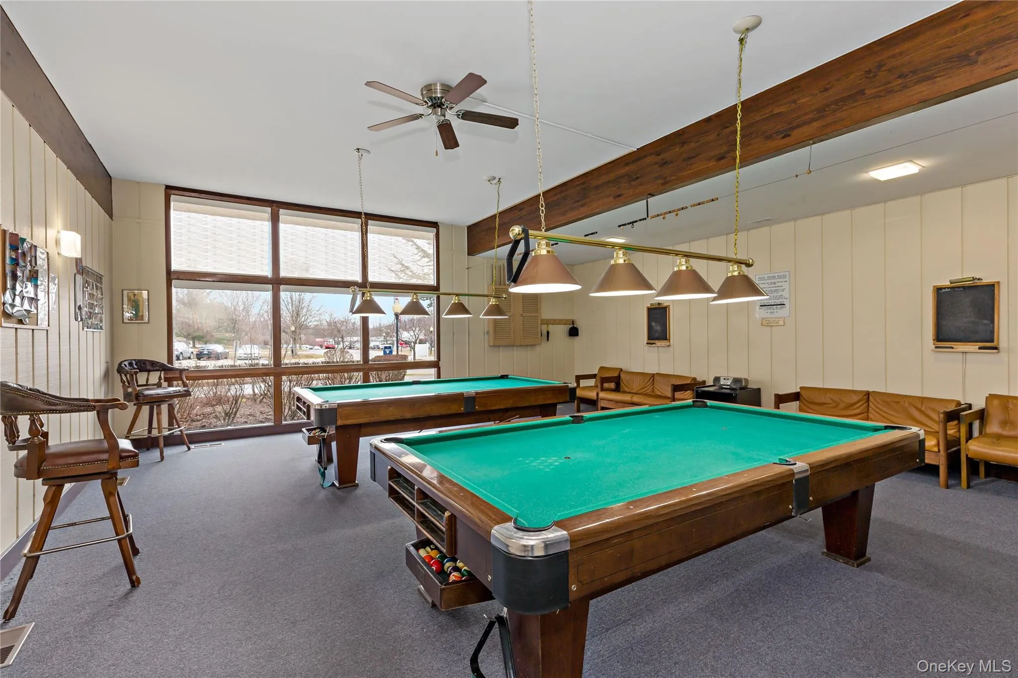 Recreation room featuring billiard tables, dart boards, seating. Recreation room featuring billiard tables, dart boards, seating.