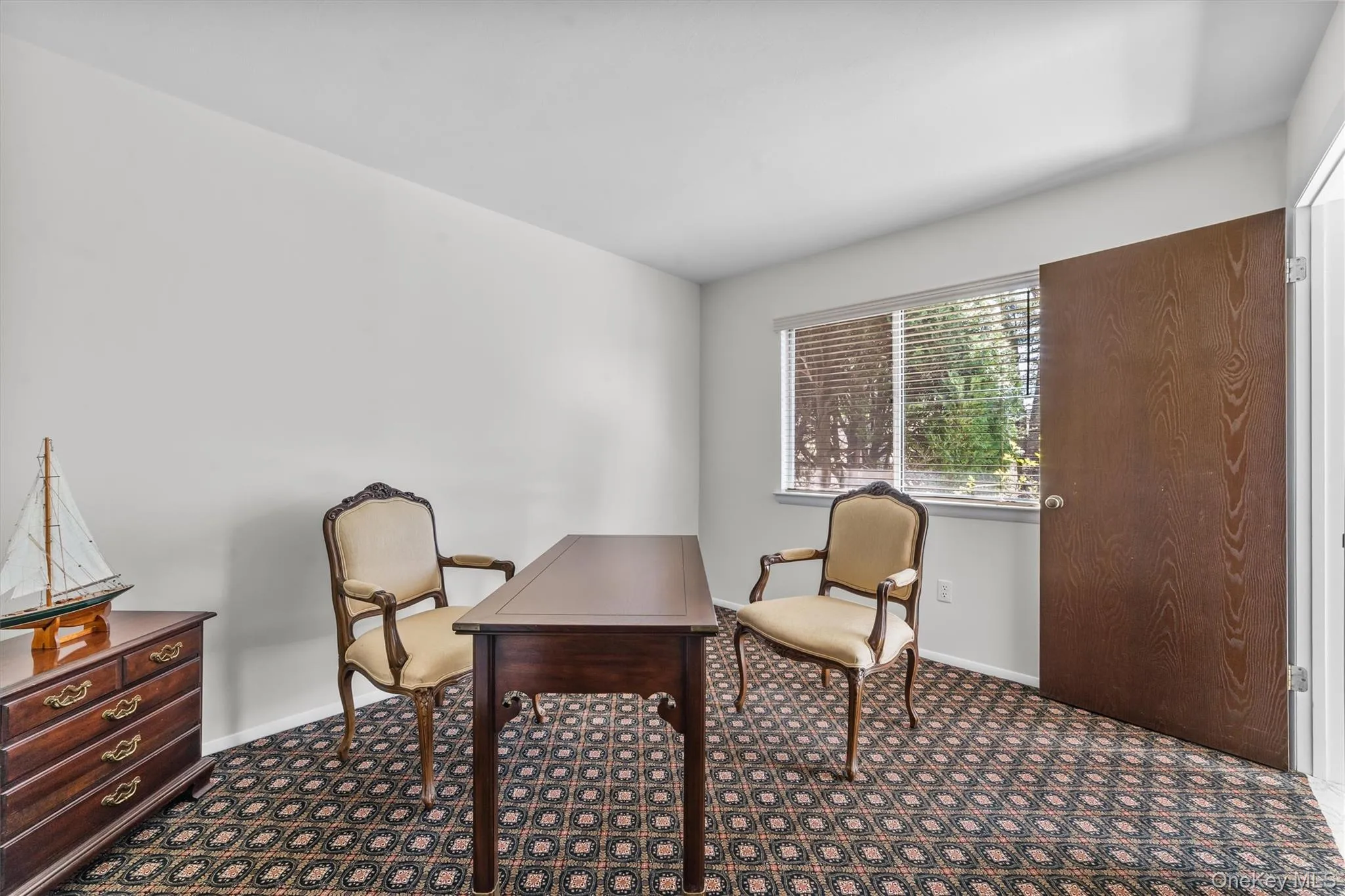 Den/Office featuring designer carpet and oversized windows. Den/Office featuring designer carpet and oversized windows.