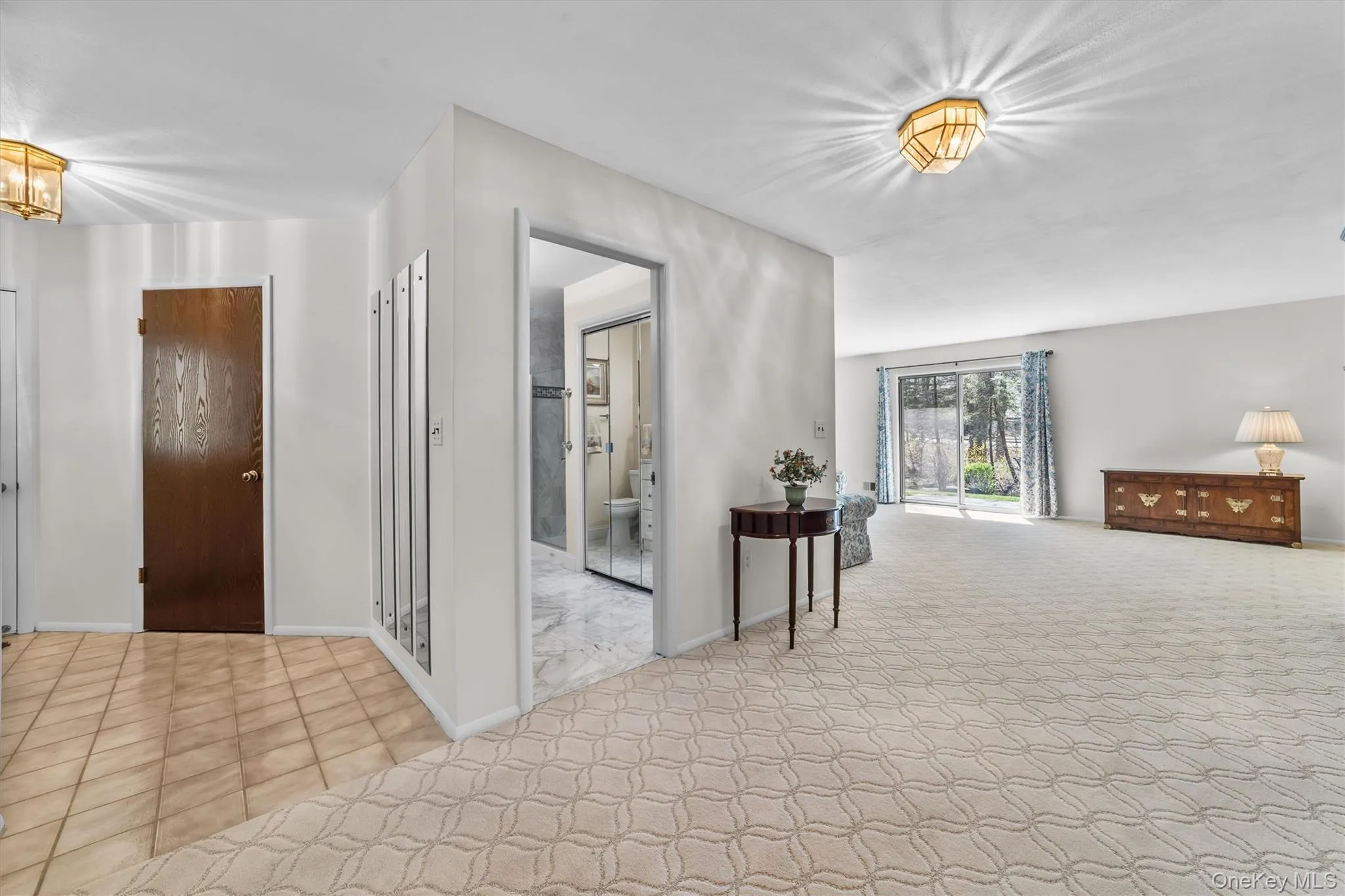 Hall to living room an inviting approach to the living room with enough space for extra furniture. Hall to living room an inviting approach to the living room with enough space for extra furniture.