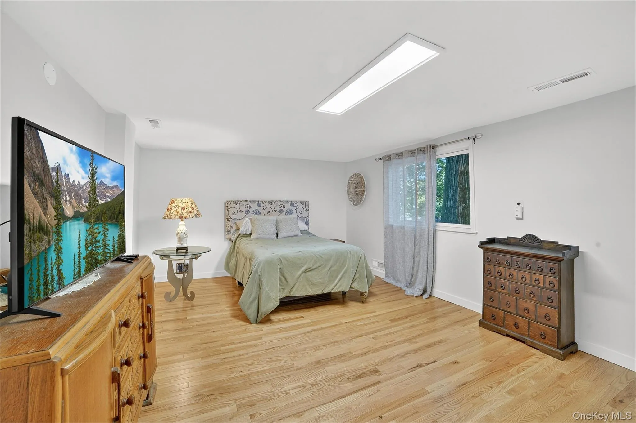 Lower Level Bedroom featuring light wood finished floors and baseboards Lower Level Bedroom featuring light wood finished floors and baseboards