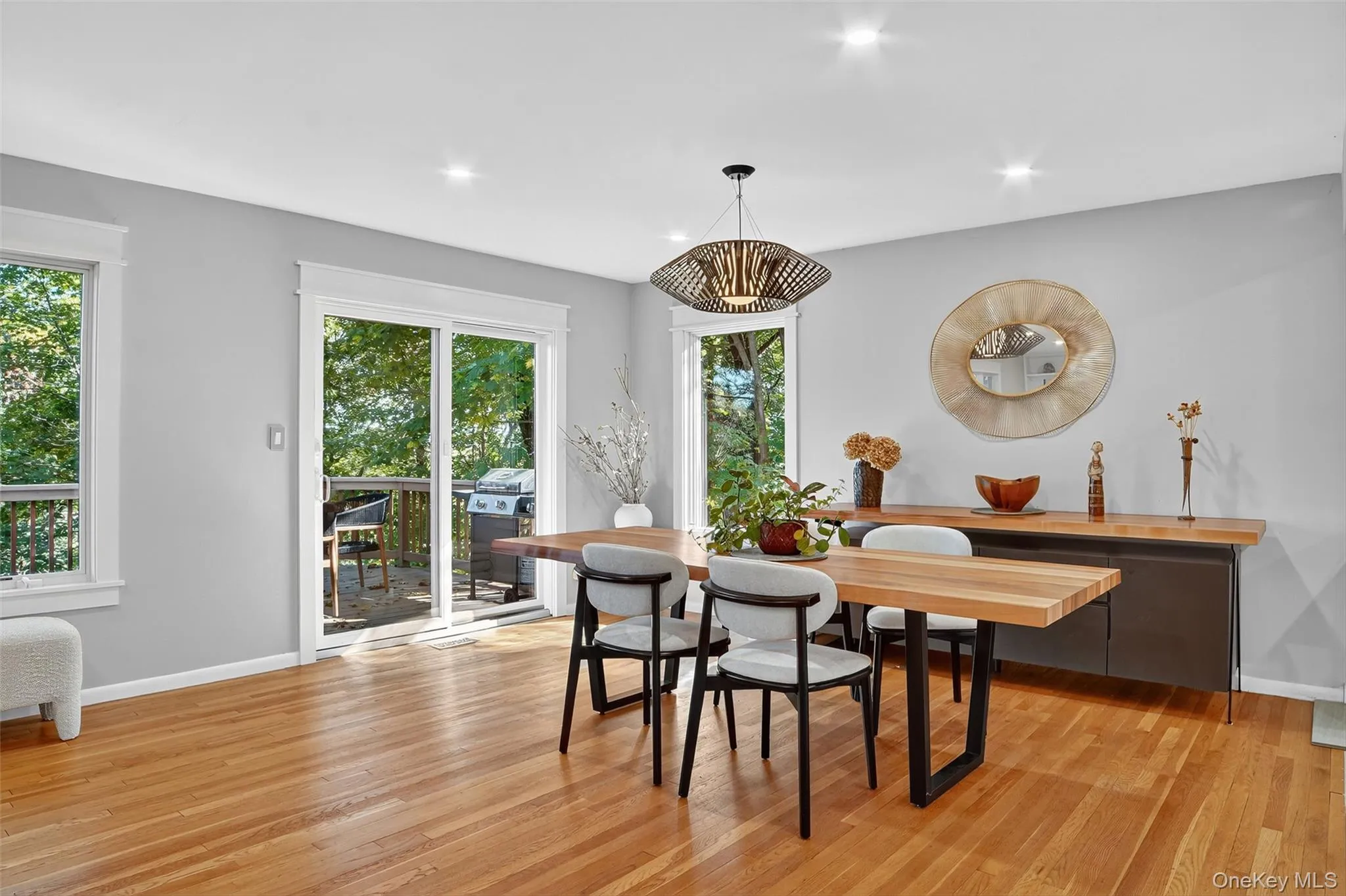 Dining space with light wood-style flooring and recessed lighting Dining space with light wood-style flooring and recessed lighting