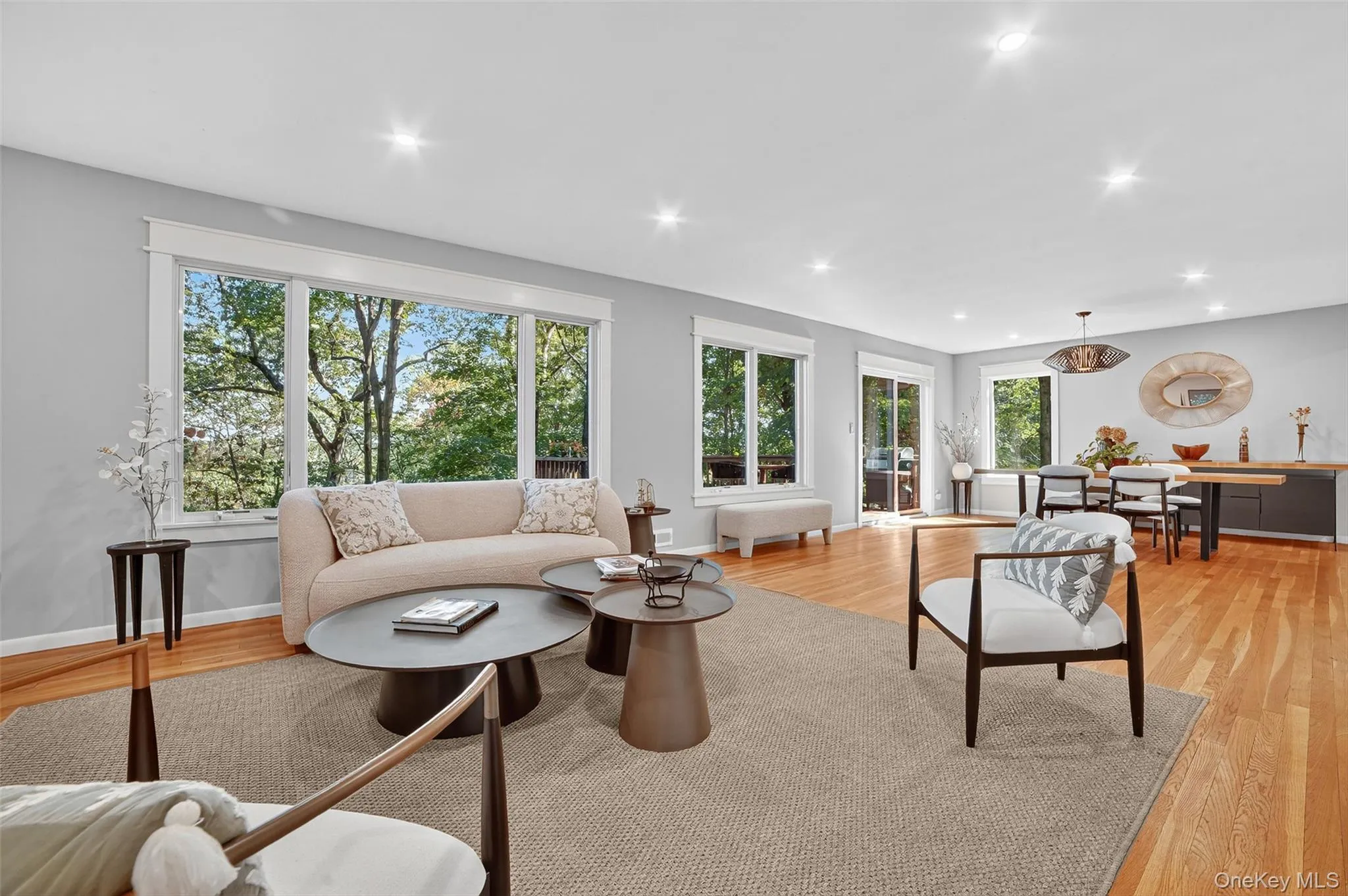 Living area featuring light wood-style flooring and recessed lighting Living area featuring light wood-style flooring and recessed lighting