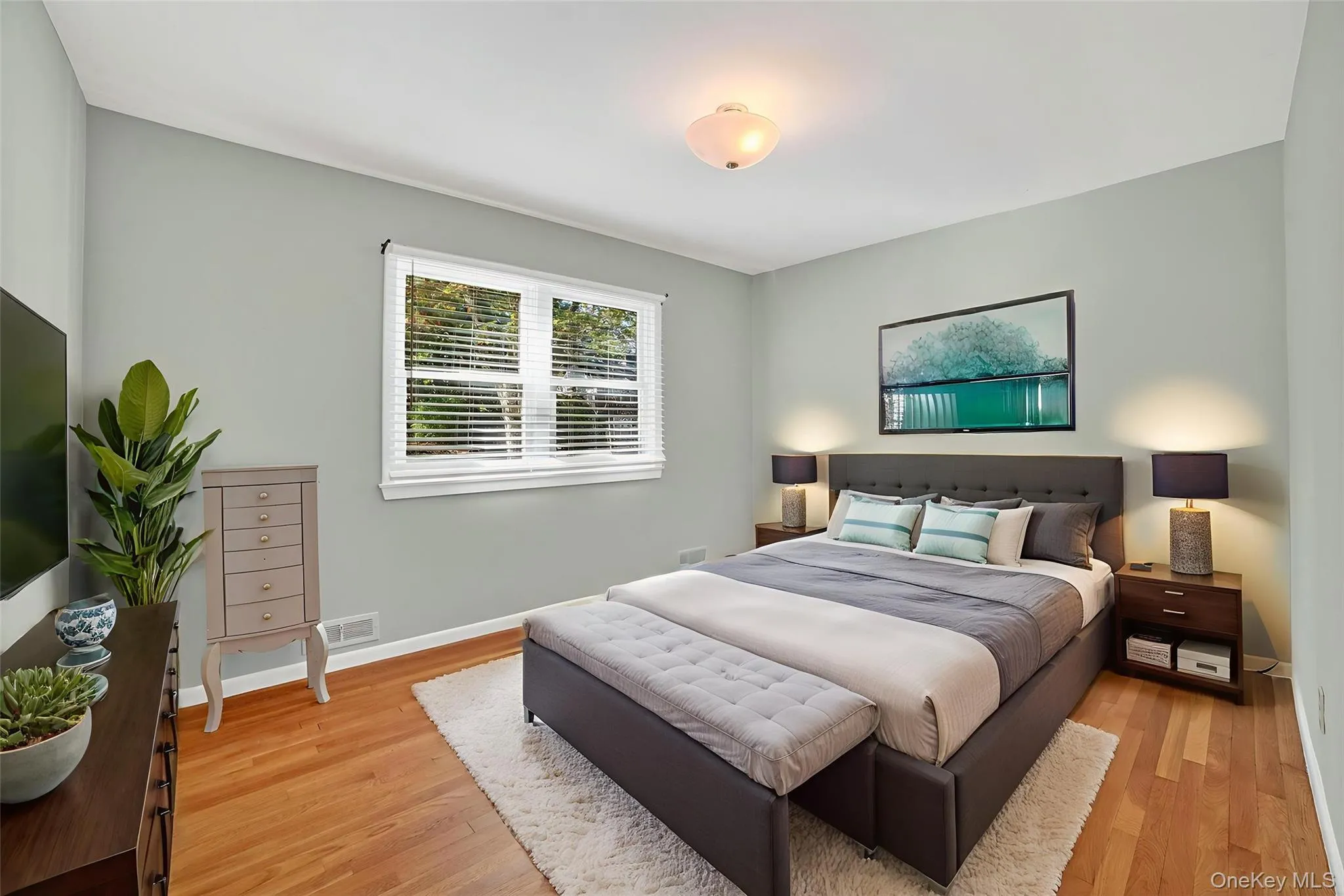 Bedroom featuring light wood-style floors Bedroom featuring light wood-style floors