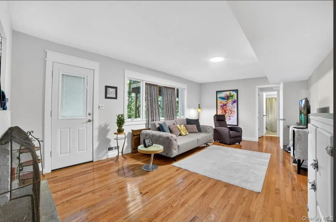 Lower Level room featuring light wood-type flooring and baseboards Lower Level room featuring light wood-type flooring and baseboards