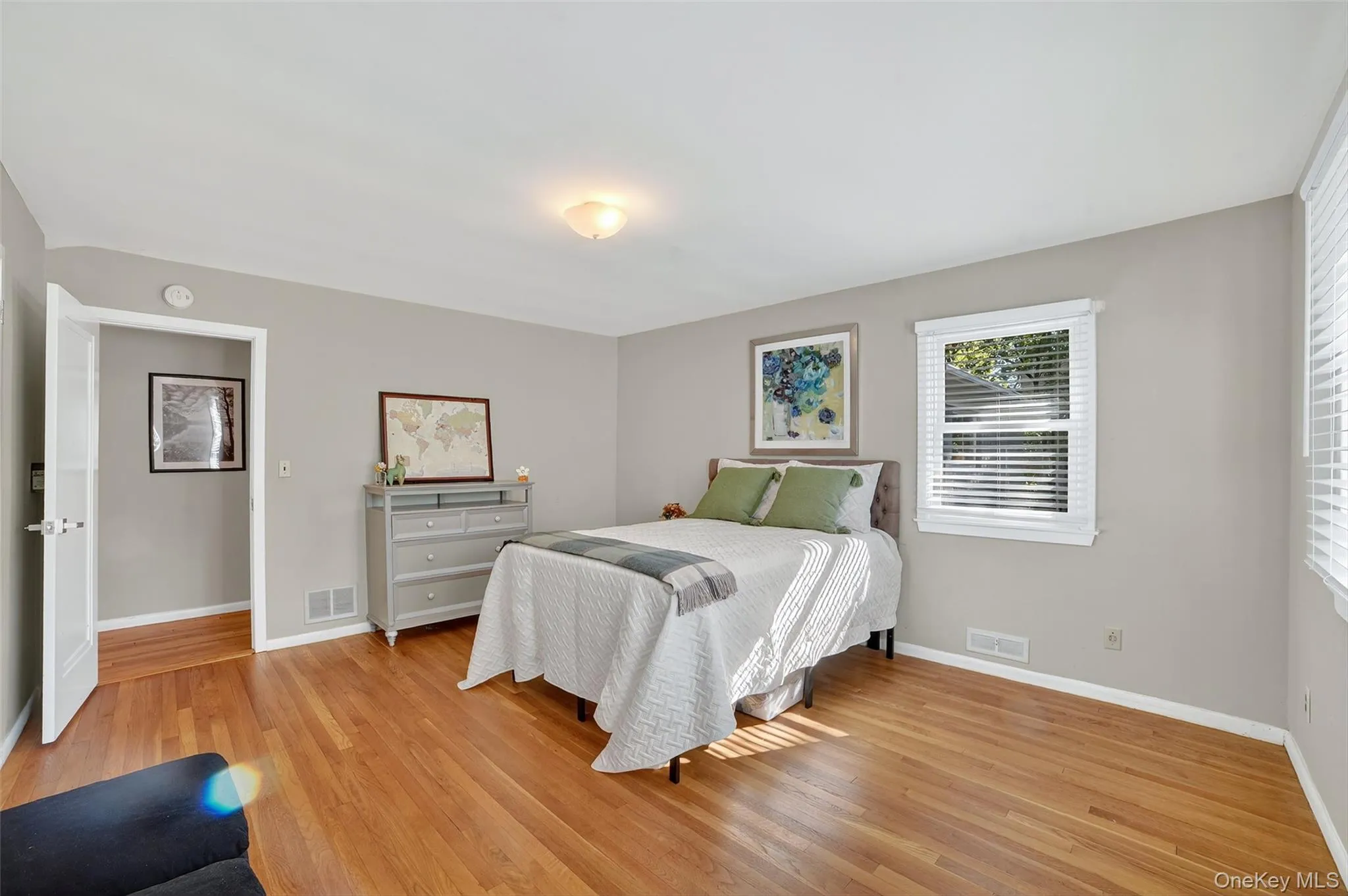 Bedroom with light wood-style flooring Bedroom with light wood-style flooring