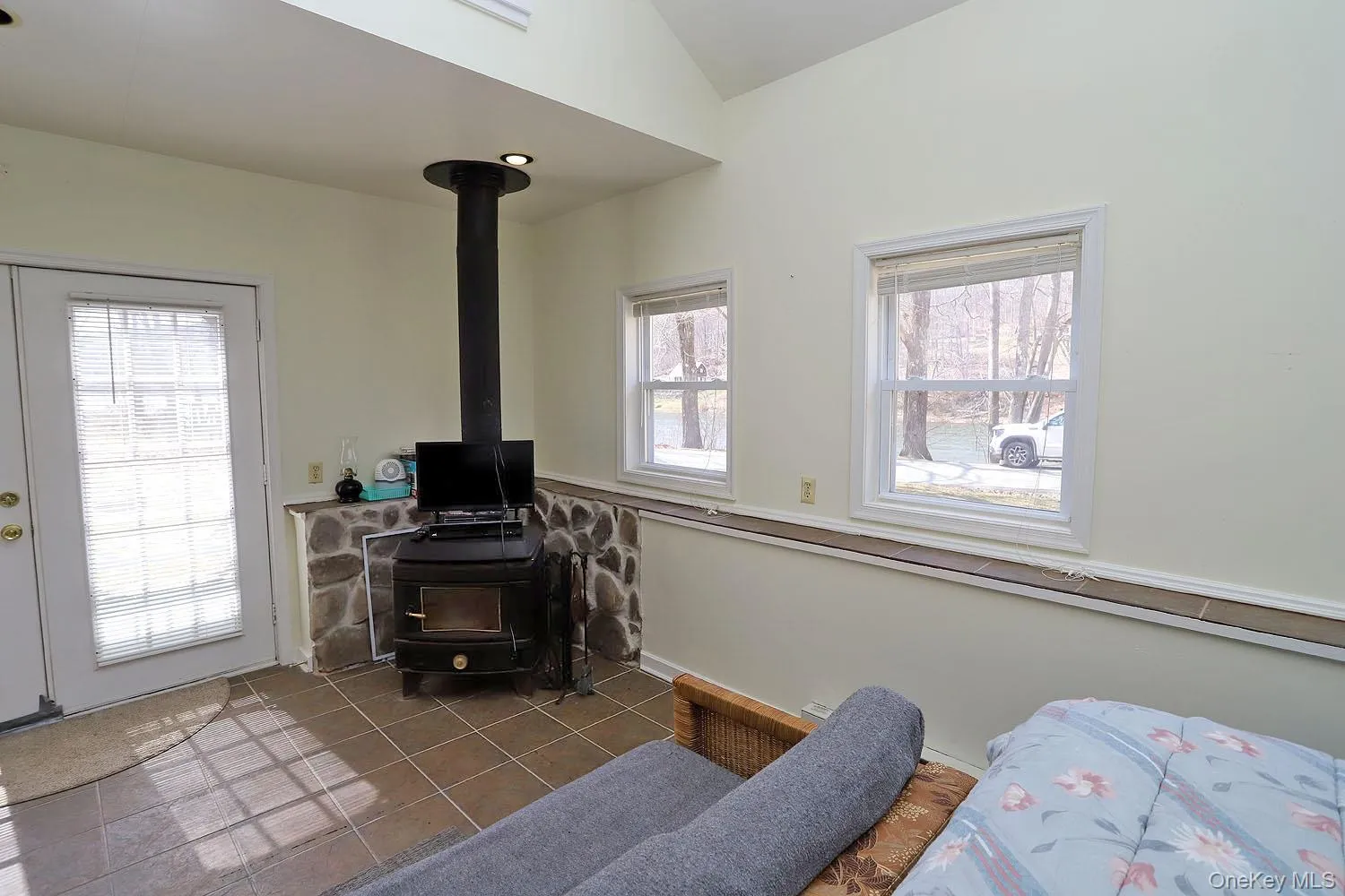 Woodstove and French doors to patio. Woodstove and French doors to patio.