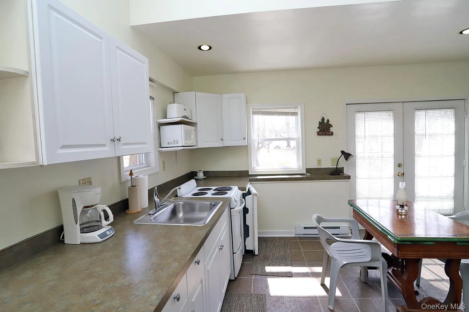 Kitchen and dining area. Kitchen and dining area.