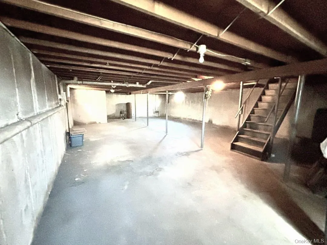 Unfinished basement with stairway Unfinished basement with stairway