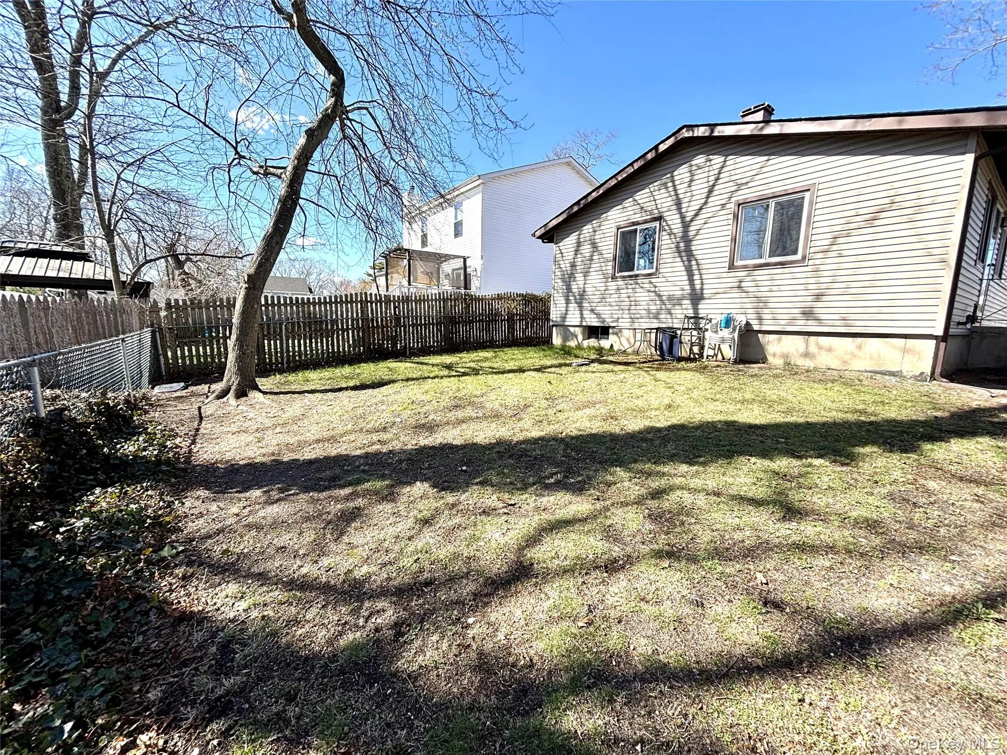 Back of house featuring a fenced backyard Back of house featuring a fenced backyard