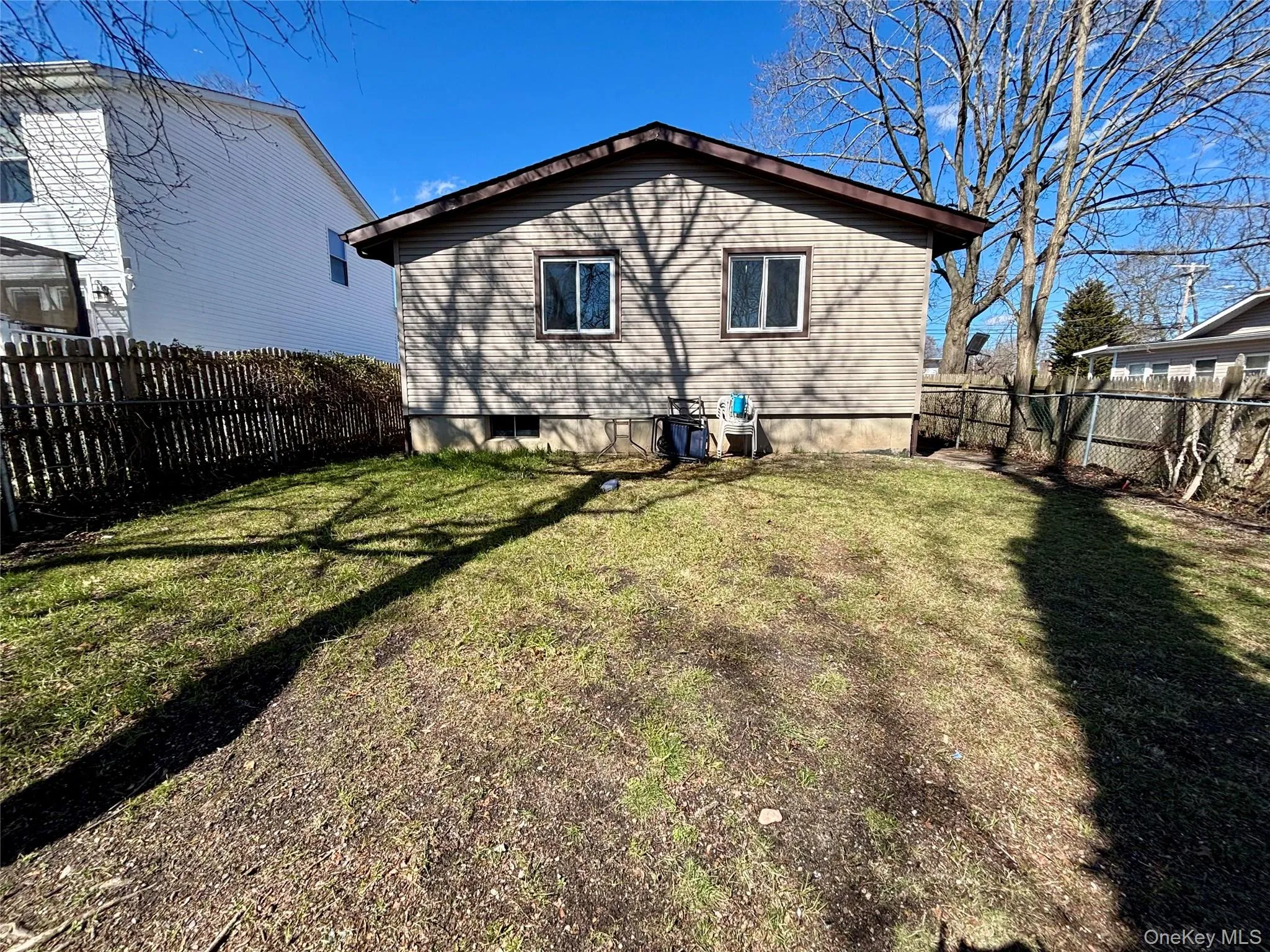 Back of house featuring a fenced backyard Back of house featuring a fenced backyard