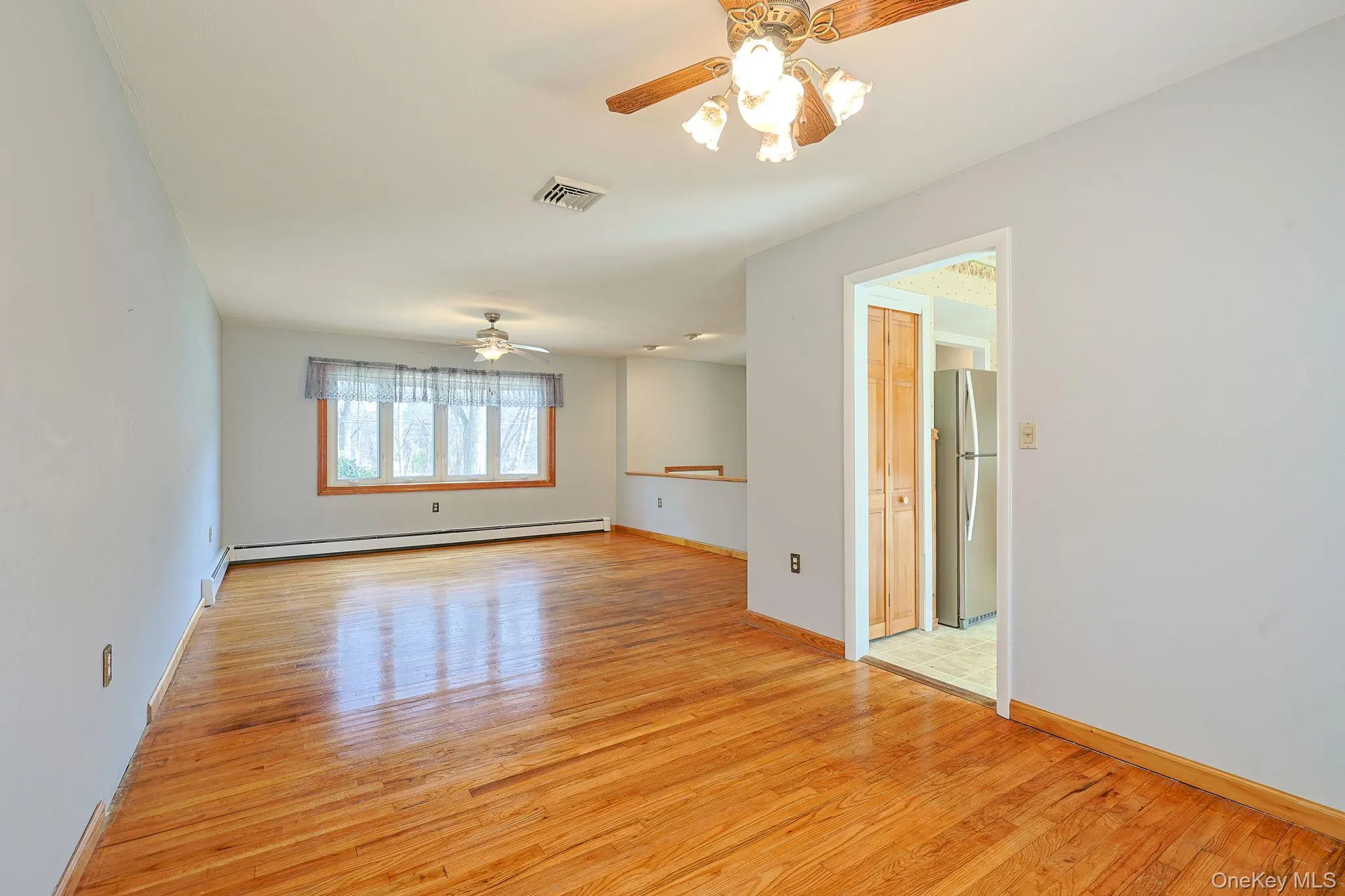 Living/dining area with ceiling fan Living/dining area with ceiling fan