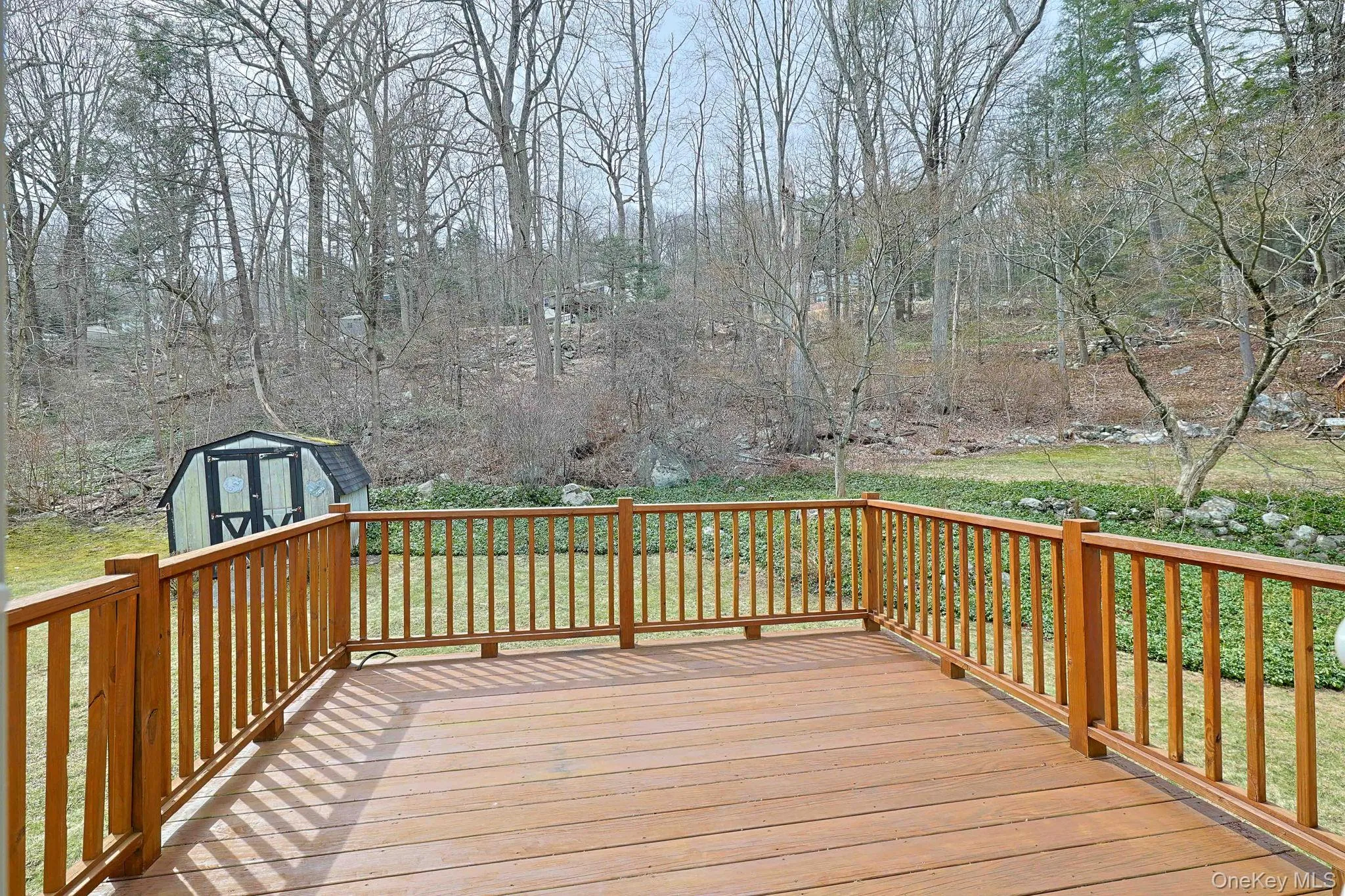 Large deck off kitchen with view of back yard Large deck off kitchen with view of back yard