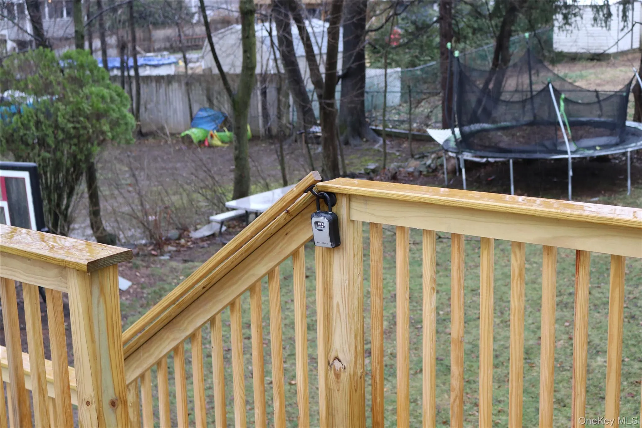 Wooden deck with combo lockbox location Wooden deck with combo lockbox location