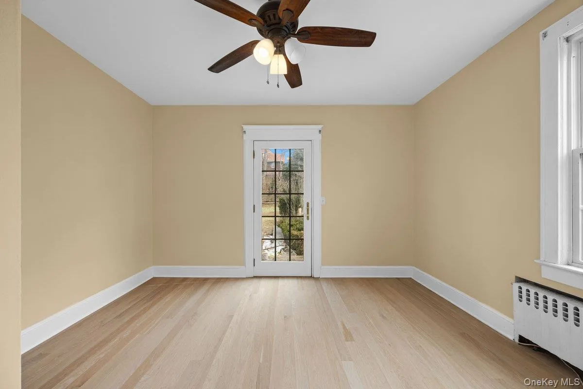Bedroom #2 with hardwood flooring, ceiling fan, radiant heating and french door Bedroom #2 with hardwood flooring, ceiling fan, radiant heating and french door