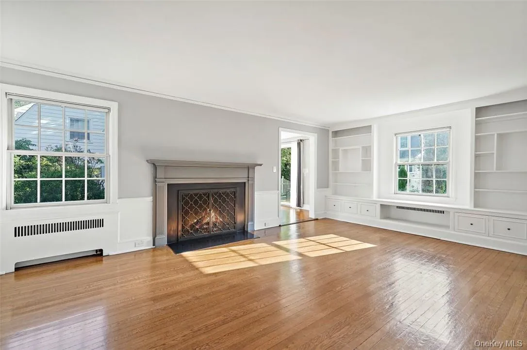 Living room with wood burning fireplace and built-ins Living room with wood burning fireplace and built-ins