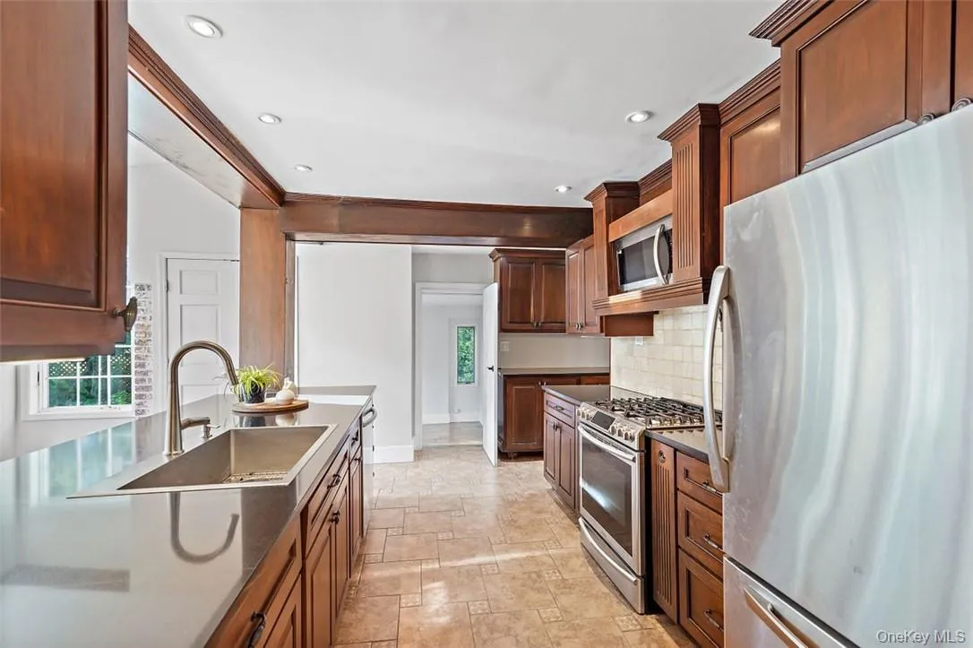 Kitchen equipped with stainless steel appliances Kitchen equipped with stainless steel appliances