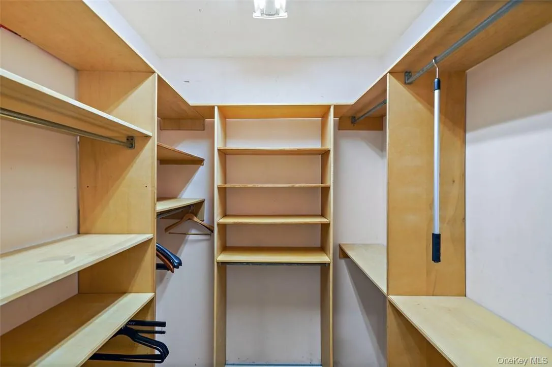 Spacious walk-in closet Spacious walk-in closet