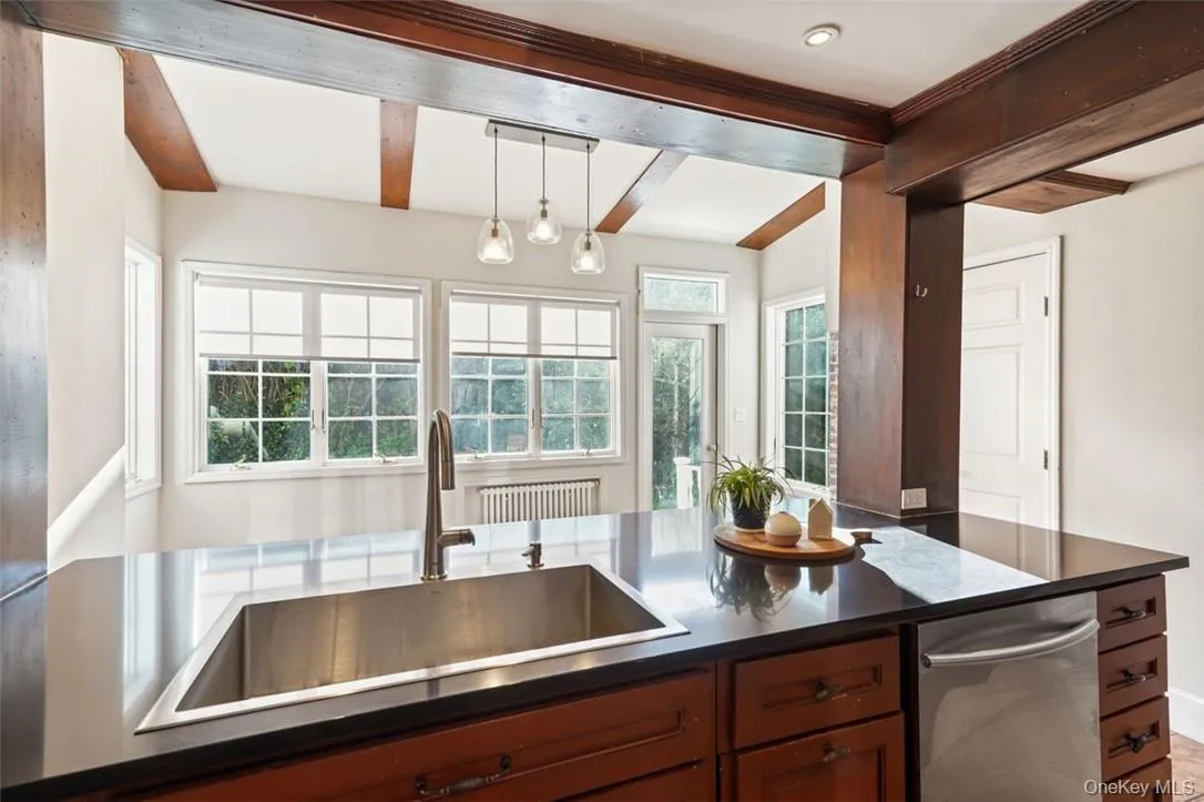 Kitchen with beamed ceiling and pendant lighting Kitchen with beamed ceiling and pendant lighting