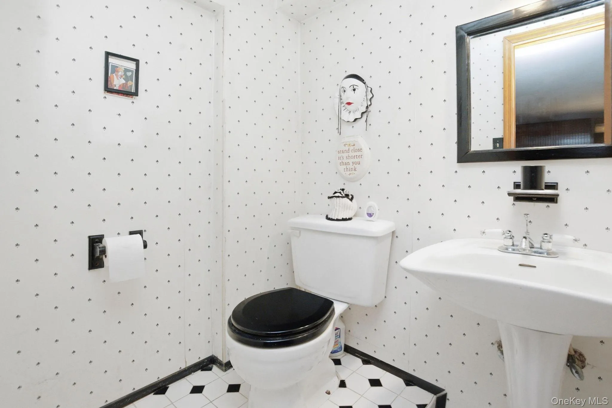 A convenient half bath on the lower level adds extra everyday function to the space. A convenient half bath on the lower level adds extra everyday function to the space.