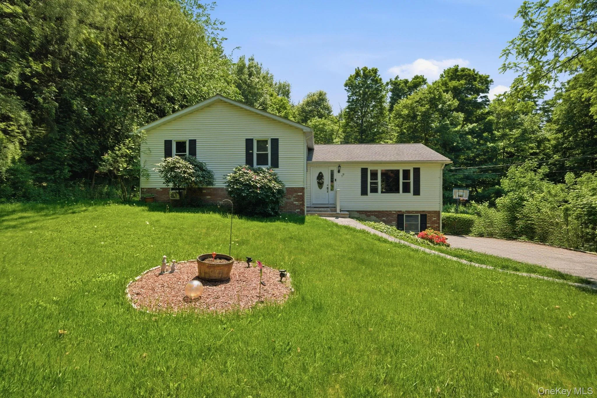 Set back from the road on a gently sloping lawn, the home enjoys a green, tucked-away setting with room to breathe. Set back from the road on a gently sloping lawn, the home enjoys a green, tucked-away setting with room to breathe.
