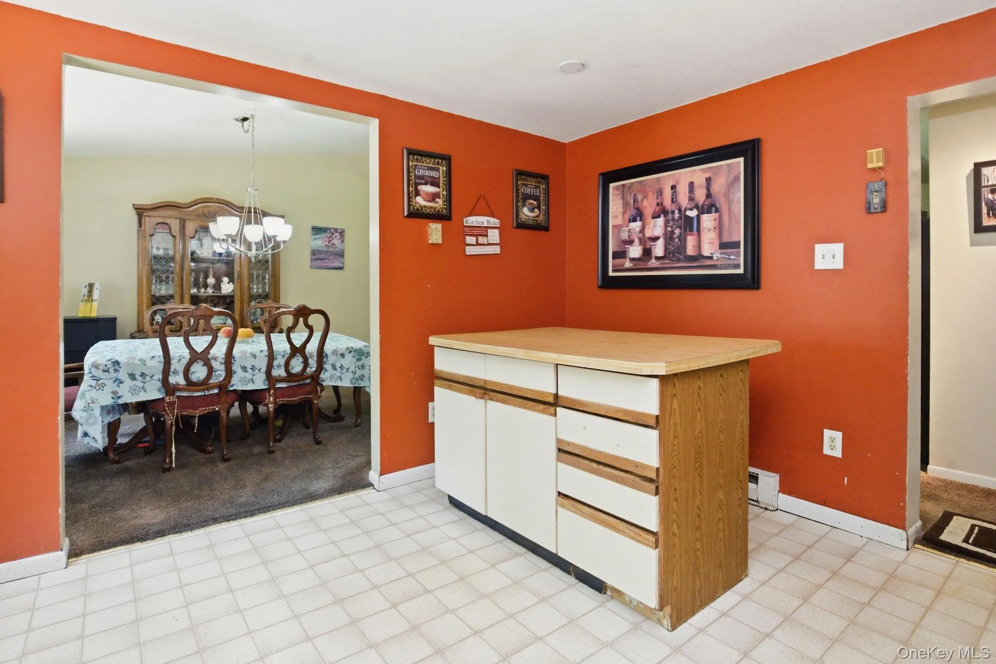 A center island offers prep space and casual seating, with the kitchen opening directly to the dining room. A center island offers prep space and casual seating, with the kitchen opening directly to the dining room.