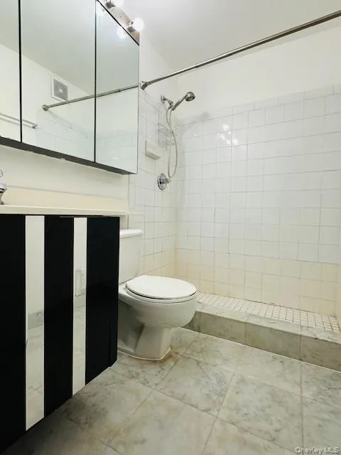 Mater Bathroom featuring vanity and a tile shower Mater Bathroom featuring vanity and a tile shower