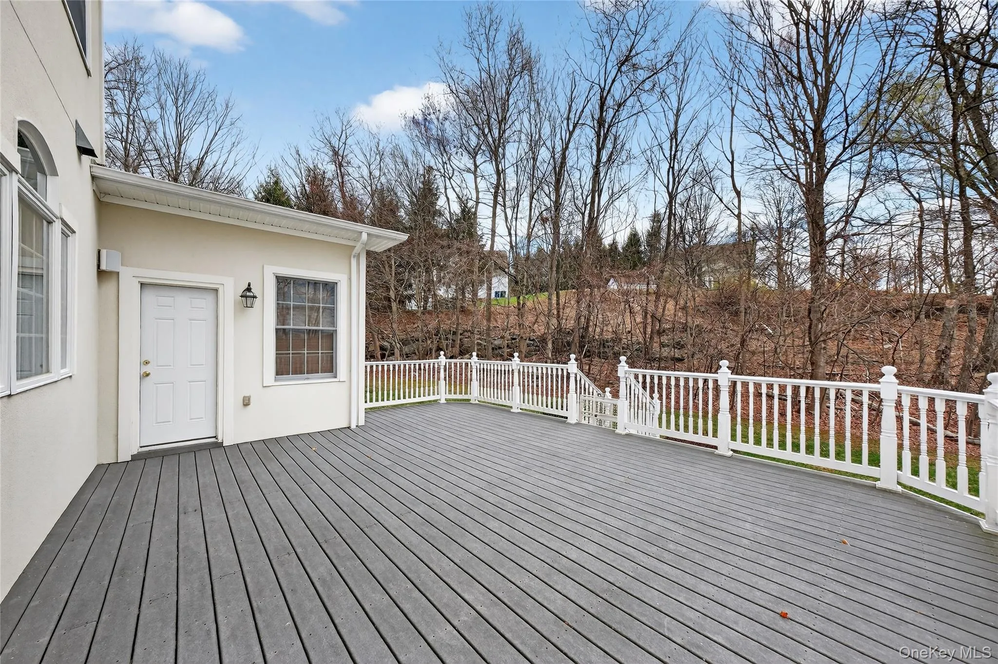 Another view of the rear deck also accessible from the home office on the main level. Another view of the rear deck also accessible from the home office on the main level.