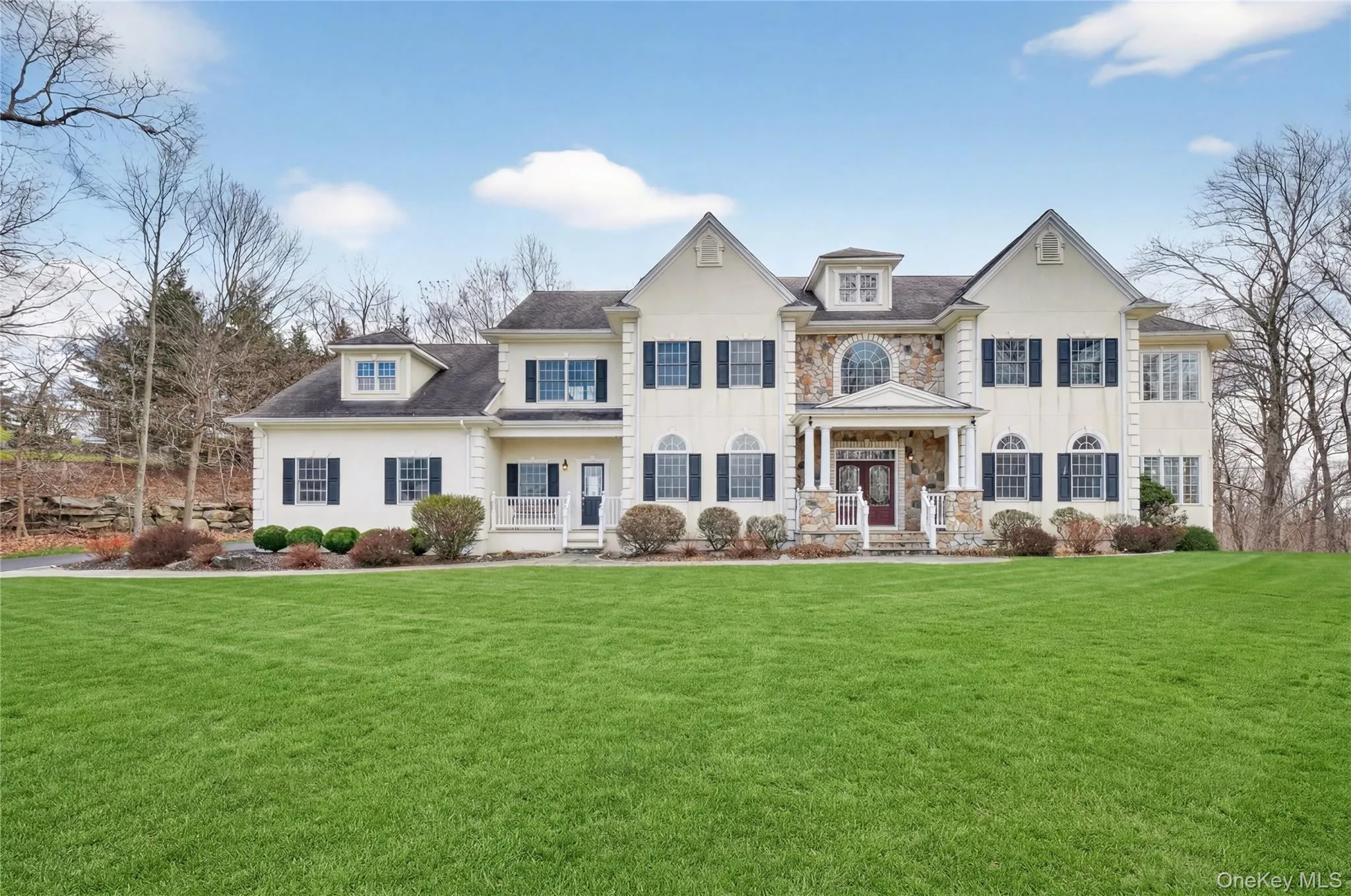 Stately five-bedroom colonial overlooks an expansive lawn. This house is located on the cul-de-sac. Stately five-bedroom colonial overlooks an expansive lawn. This house is located on the cul-de-sac.