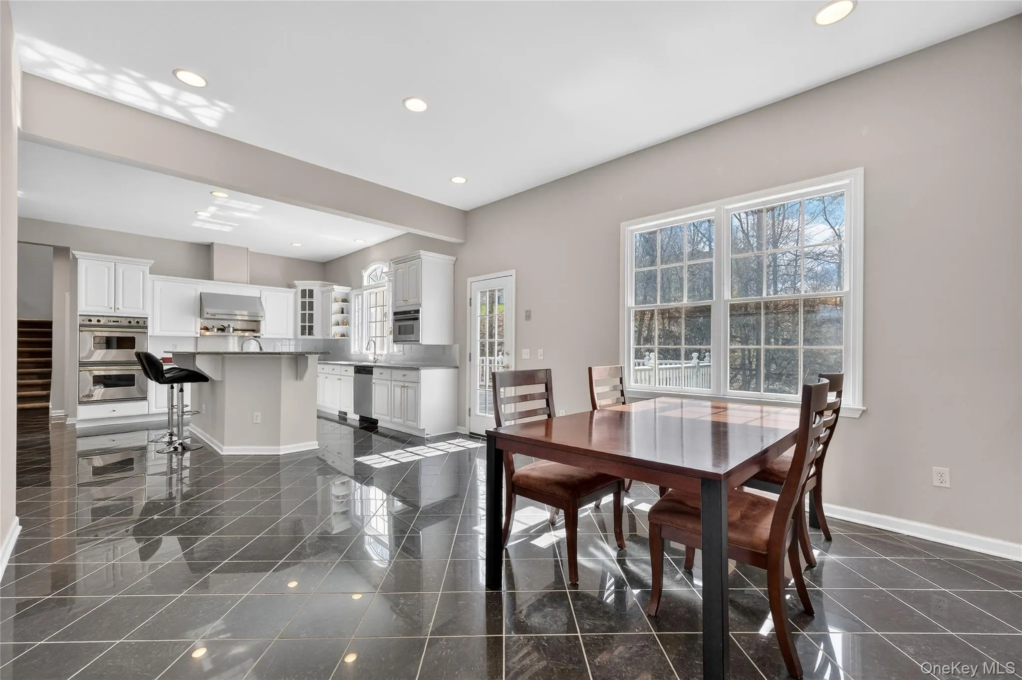 The breakfast area is open to the kitchen and there is a door to the rear deck. The breakfast area is open to the kitchen and there is a door to the rear deck.