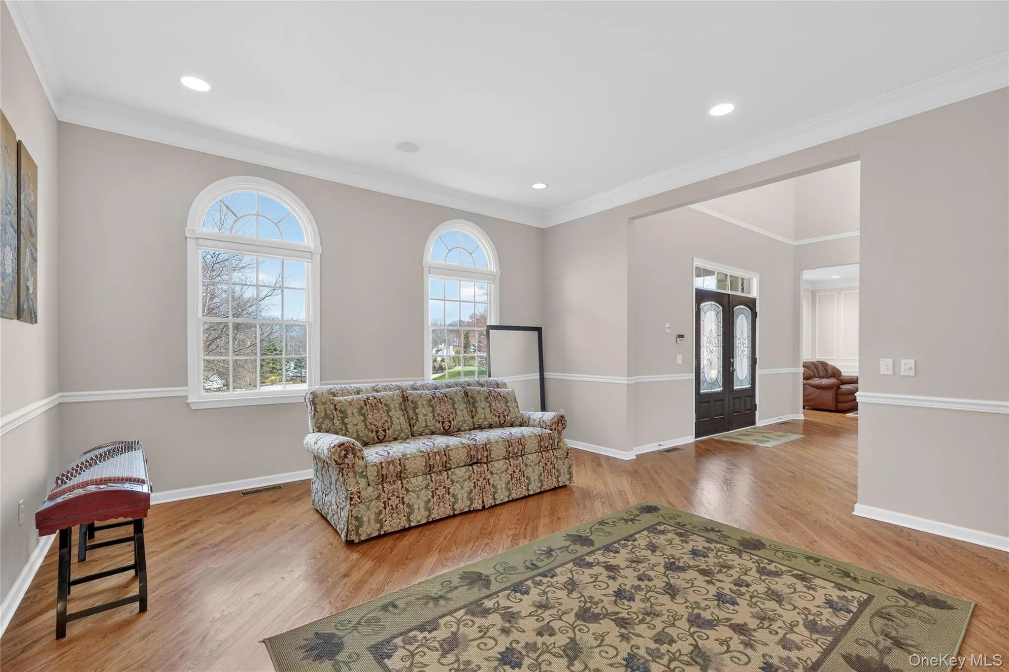 Custom crown, chair-rail, and picture-frame moldings adorn the living room, dining room, and family room. Custom crown, chair-rail, and picture-frame moldings adorn the living room, dining room, and family room.
