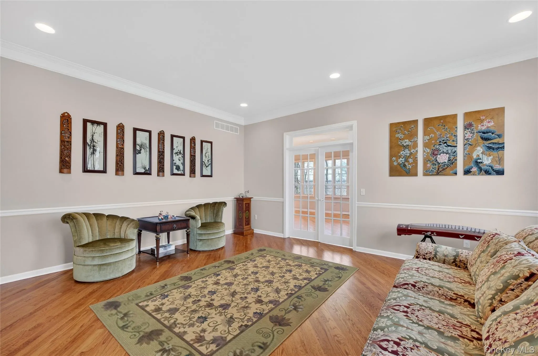 Gleaming hardwood floors in the living room, dining room, foyer and conservatory. Gleaming hardwood floors in the living room, dining room, foyer and conservatory.