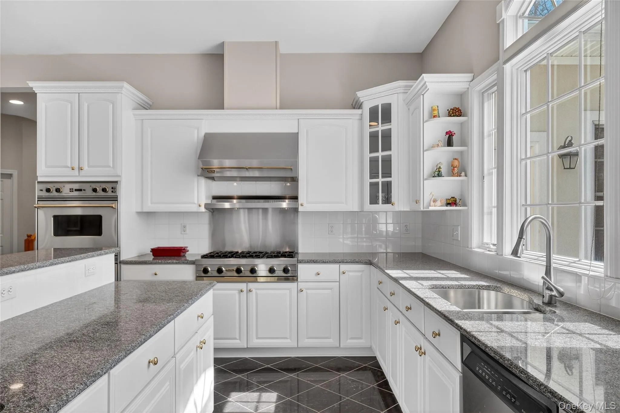 The gourmet kitchen boasts a large center island and stainless-steel, Viking appliances. The gourmet kitchen boasts a large center island and stainless-steel, Viking appliances.