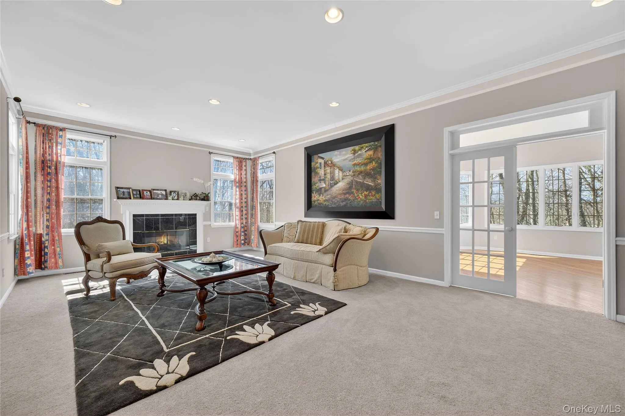 The spacious family room offers a wet bar and is open to the kitchen. The spacious family room offers a wet bar and is open to the kitchen.