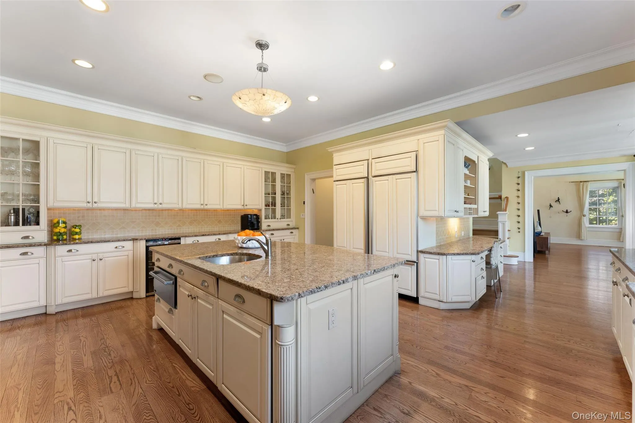 Custom cabinetry, granite countertops, and massive center island Custom cabinetry, granite countertops, and massive center island