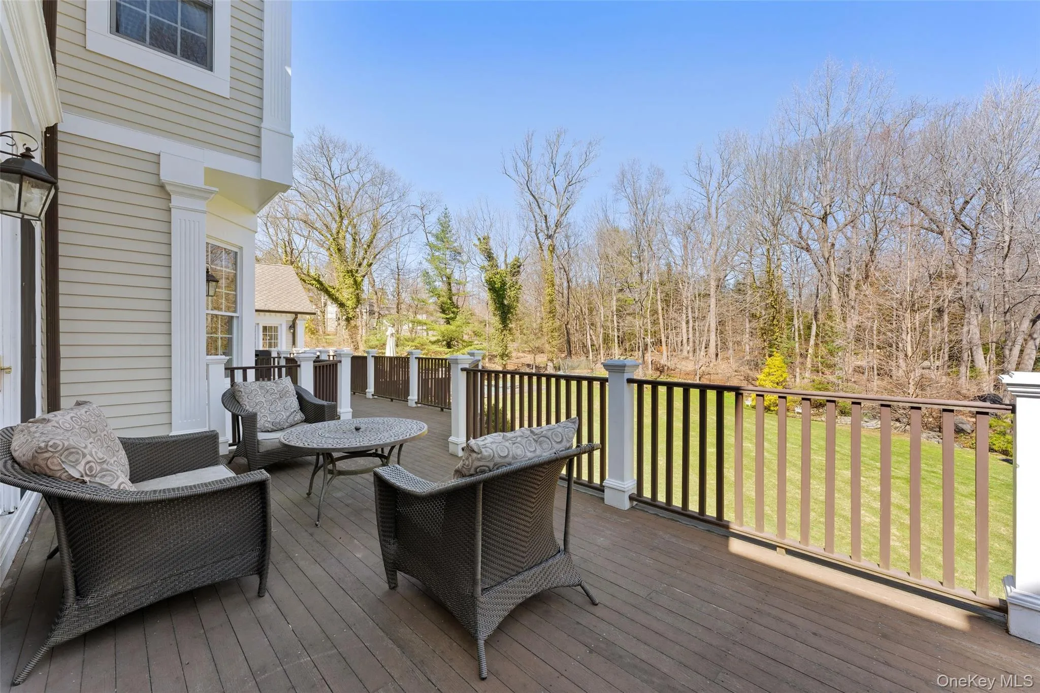Large deck overlooking the park-like 1.27 acre grounds Large deck overlooking the park-like 1.27 acre grounds
