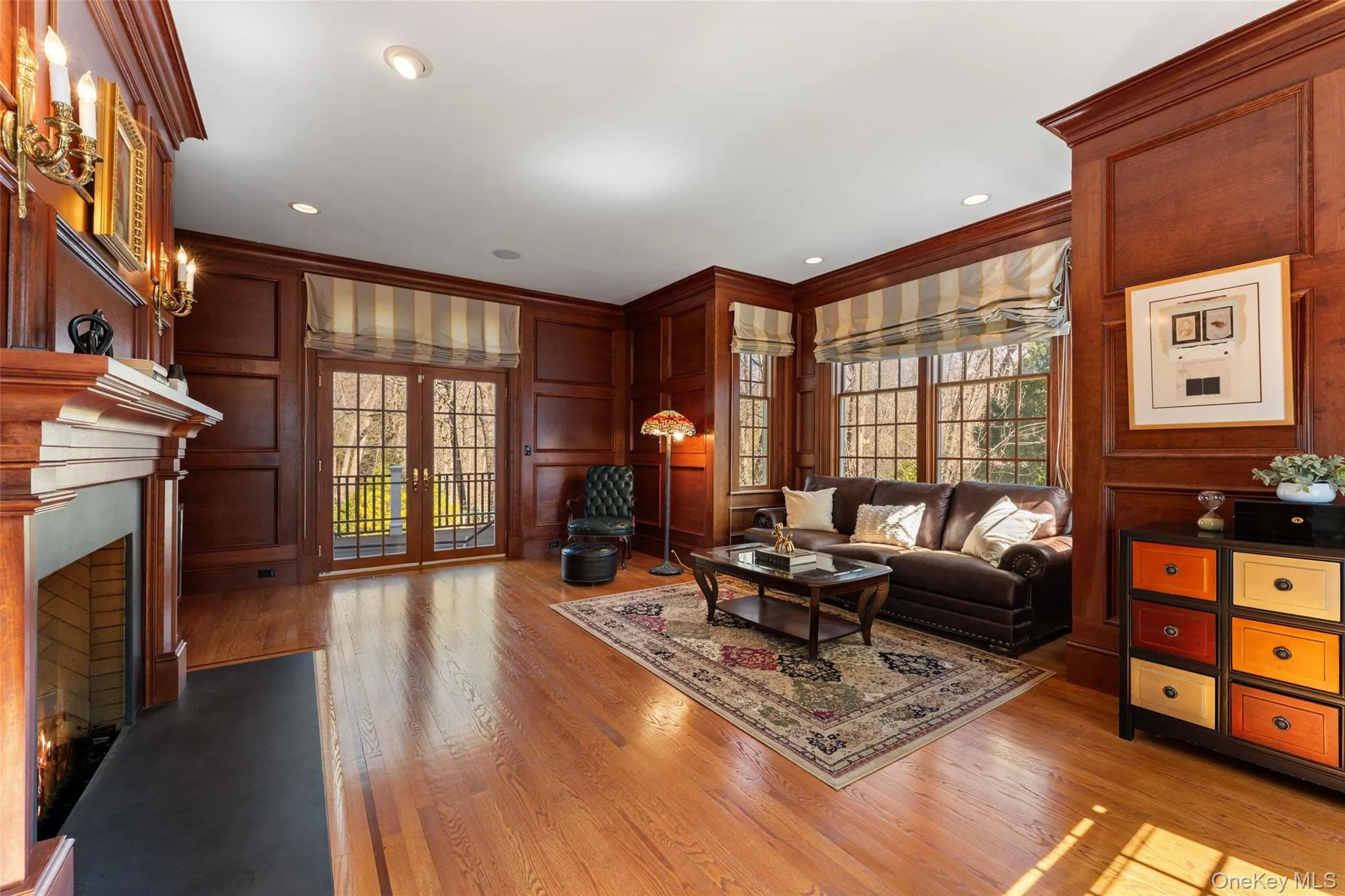 Handsome wood paneled study with wood burning fireplace Handsome wood paneled study with wood burning fireplace