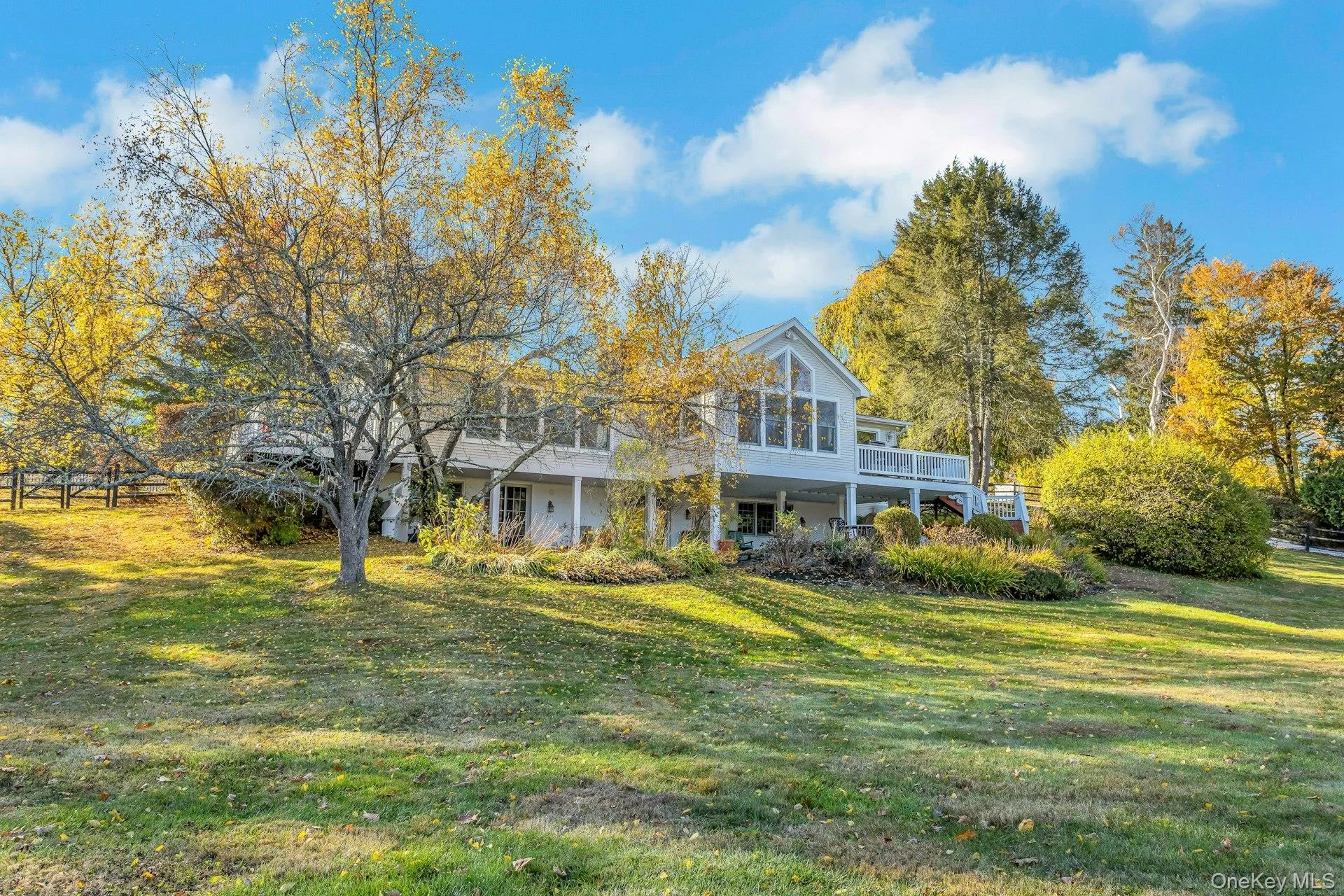 Back of property featuring a yard Back of property featuring a yard